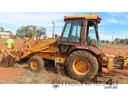 caption 580K CASE Backhoe