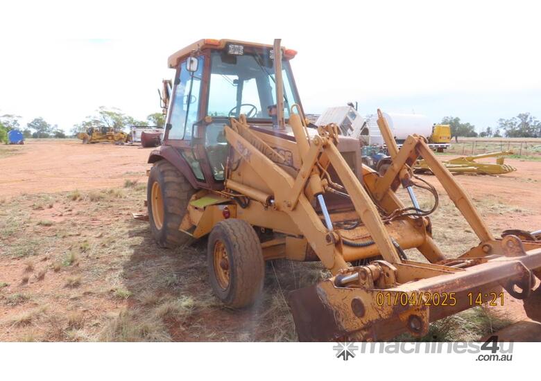 caption 580K CASE Backhoe