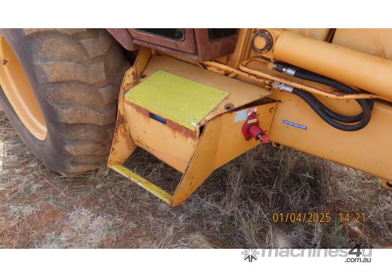 caption 580K CASE Backhoe
