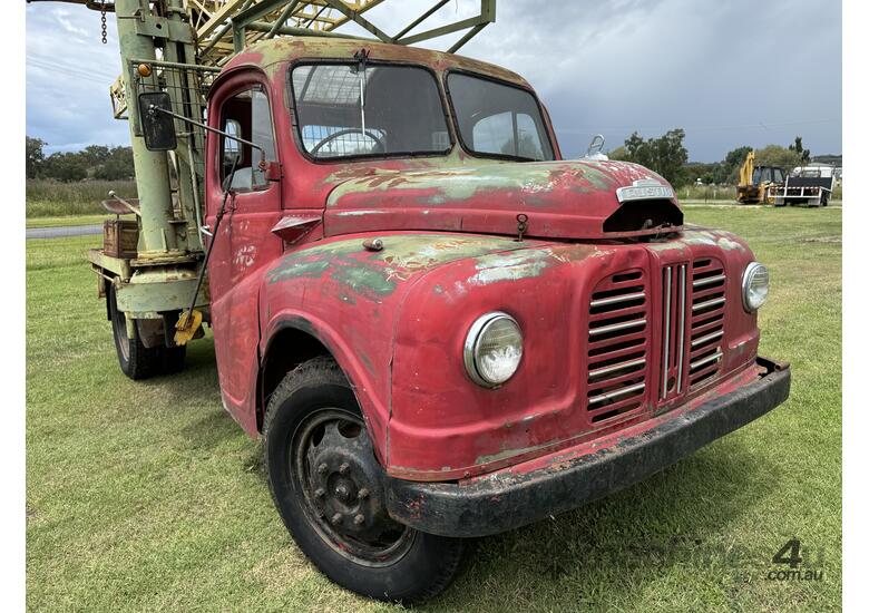 caption Austin K2 Loadstar MK2 4x2 2 Tonne Tabletop with Drilling Rig/Borer Unit on Tray Truck.
