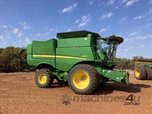 caption JD S670 HARVESTER