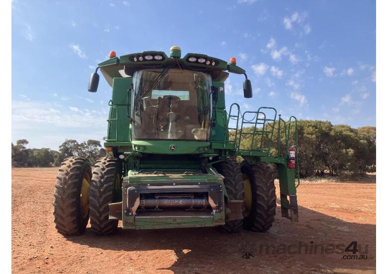 caption JD S670 HARVESTER