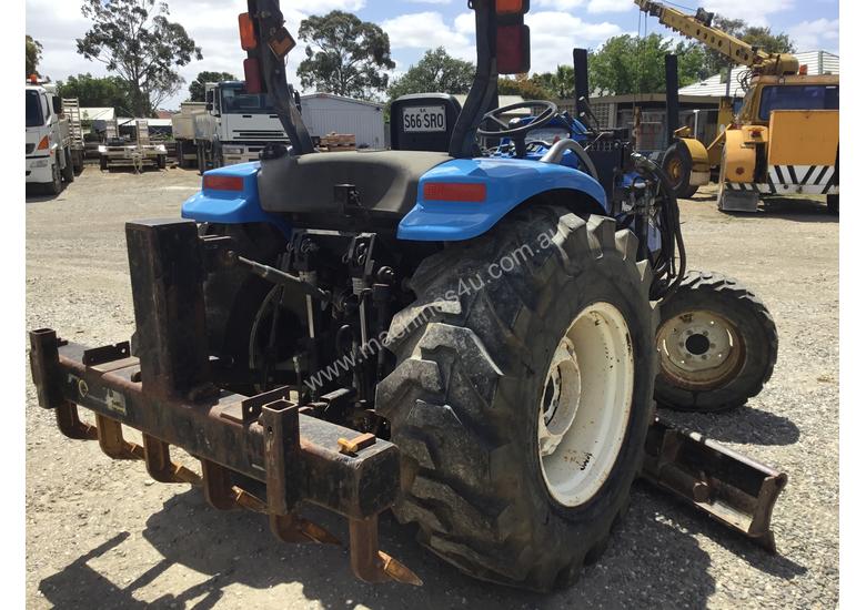 caption New Holland Compact Grader