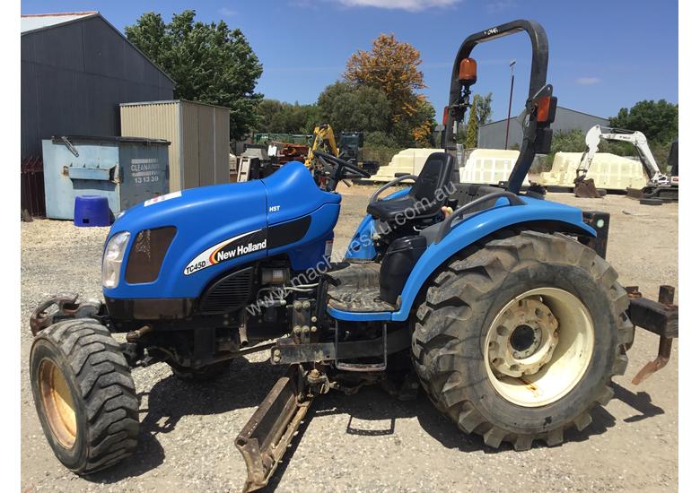 caption New Holland Compact Grader