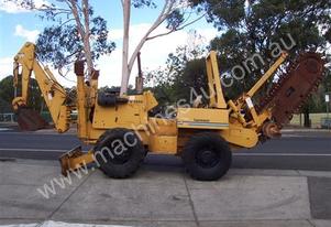 V 5800 Vermeer Trencher , b/hoe on front 1900 hrs