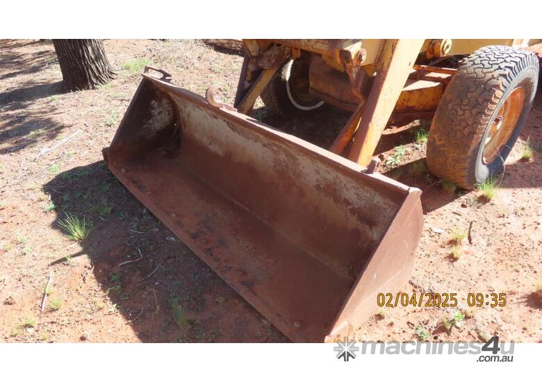 caption John Deere Backhoe