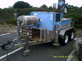 drilling rig , tandem trailer mount , 3cyl perkins / cat powered - picture0' - Click to enlarge