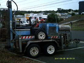 drilling rig , tandem trailer mount , 3cyl perkins / cat powered - picture1' - Click to enlarge