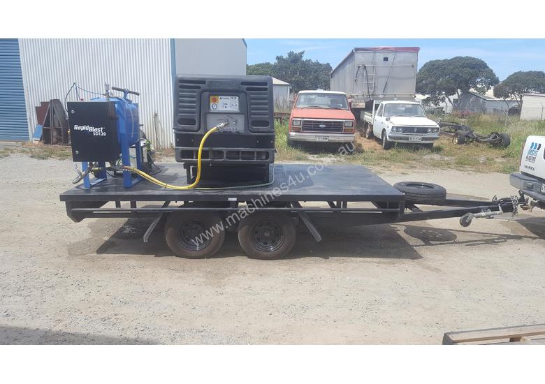 caption MOBILE DUSTLESS BLASTING TRAILER