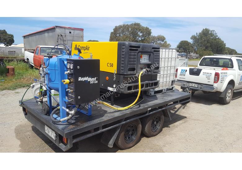 caption MOBILE DUSTLESS BLASTING TRAILER