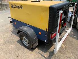 Compair C38 130 cfm portable diesel powered air compressor on 2 wheel road tow chassis - picture0' - Click to enlarge
