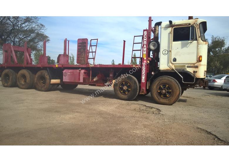 caption Kenworth K100E Cab Chassis Tri Drive Tandem Steer 10X6