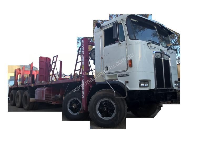 caption Kenworth K100E Cab Chassis Tri Drive Tandem Steer 10X6