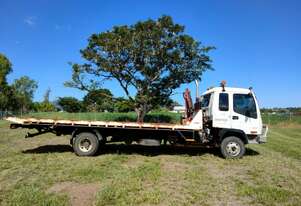 PACIFC ENERGY GROUP - HIRE - 4x2 WD Tilt Tray Truck with Palfinger PC2300 Vehicle Loading Crane PACIFC ENERGY GROUP - HIRE - 4x2 WD Tilt Tray Truck with Palfinger PC2300 Vehicle Loading Crane