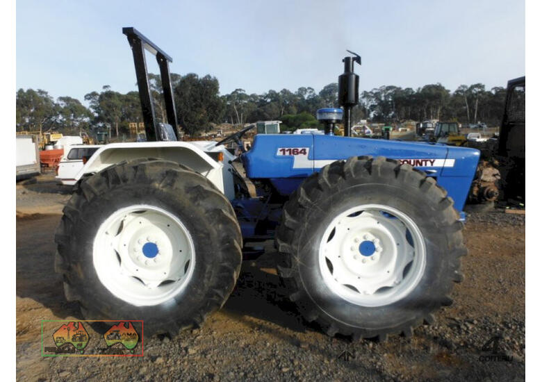 (7617) Ford County 1164 Tractor (Maryborough, VIC)