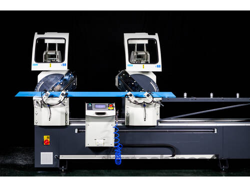 caption OZ MACHINE User friendly semi - auto double saw with 550mm blades.