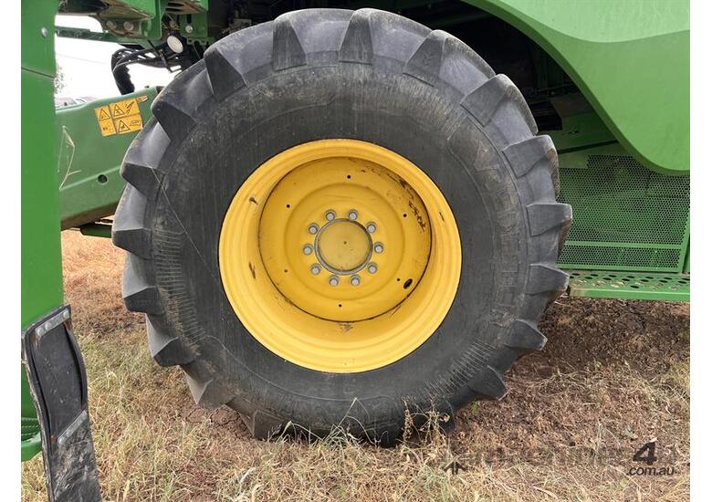 caption 2015 JOHN DEERE S670 w JOHN DEERE 640D Front