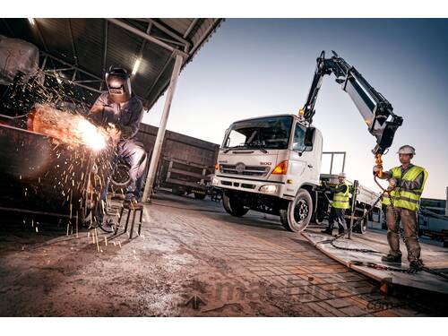 caption WATM Cranes - HIAB 072-4 HiDuo Knuckle Boom Crane: Compact, Remote-Controlled Load Handling!