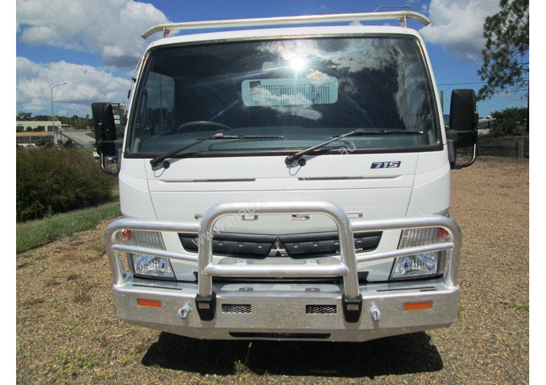 caption Mitsubishi Canter 715 Tipper Truck