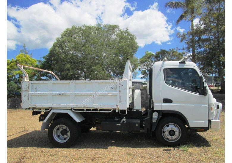 caption Mitsubishi Canter 715 Tipper Truck