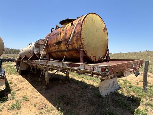 40 FOOT FLAT TOP BOGEY AXLE TRAILER WITH TANKS. 