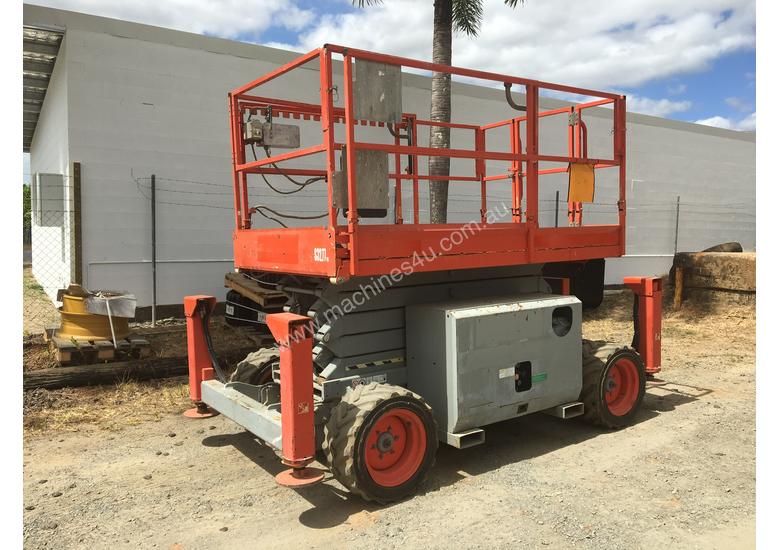 caption Rough Terrain Scissor lift 1600 hours Including Auto Levelling. A