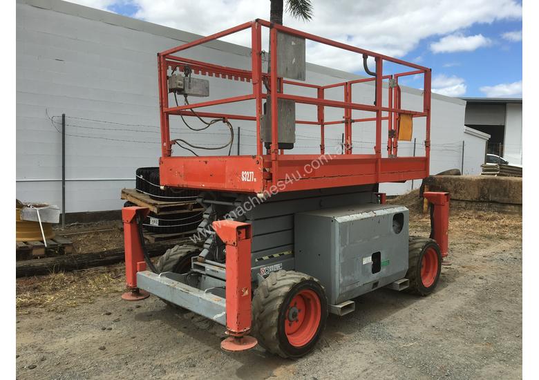 caption Rough Terrain Scissor lift 1600 hours Including Auto Levelling. A