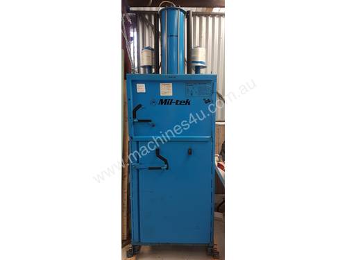 Compactor for waste material Requires compressed air