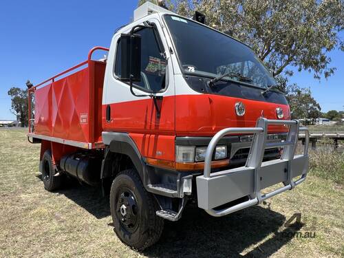 GRAND MOTOR GROUP - Mitsubishi Fuso Canter 4x4 Single Cab Traytop Firetruck.  Ex NSW Rural Fire Serv