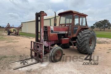 International 766 Tractor, Forklift Attachment and Post Hole Digger