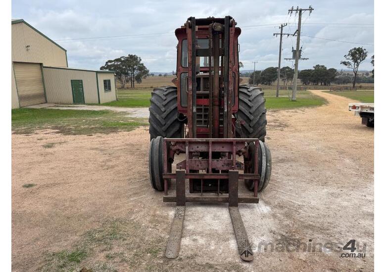 caption International 766 Tractor, Forklift Attachment and Post Hole Digger