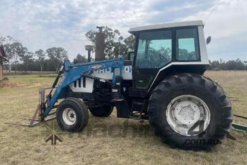 Ford 8401 Tractor, Air Cond cab, 3PL, indicating 10,545 hours, hay spears and GP bucket