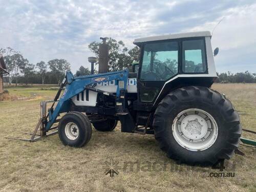 Ford 8401 Tractor, Air Cond cab, 3PL, indicating 10,545 hours, hay spears and GP bucket