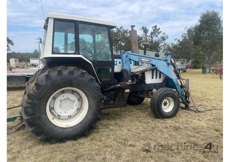 Ford 8401 Tractor, Air Cond cab, 3PL, indicating 10,545 hours, hay spears and GP bucket