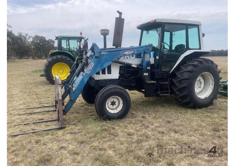 Ford 8401 Tractor, Air Cond cab, 3PL, indicating 10,545 hours, hay spears and GP bucket