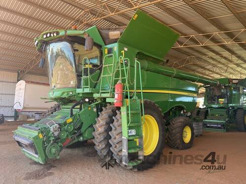 caption 2021 John Deere S780 Combines