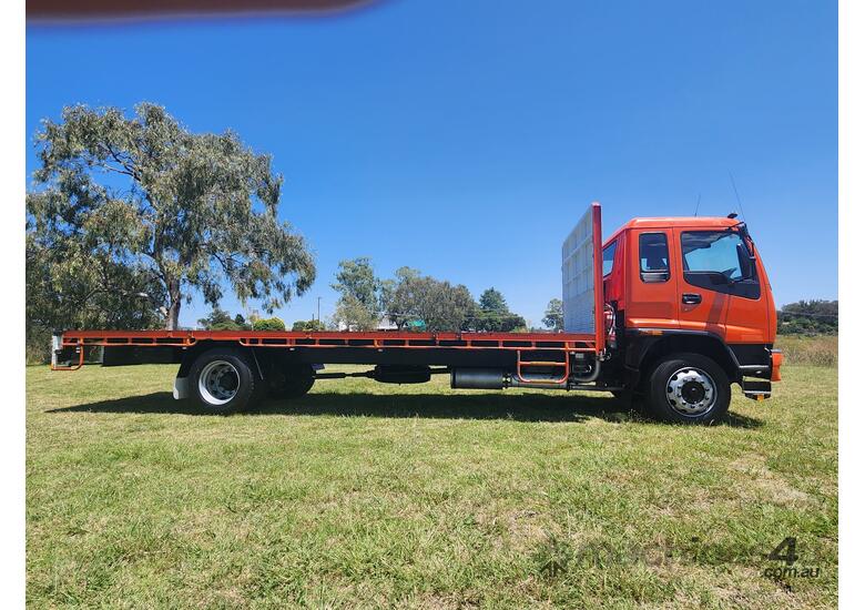 caption Isuzu FTR900 Long 4x2 Traytop Truck. One Fleet Owner