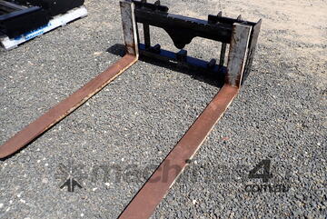 Fork carriage for skid steers