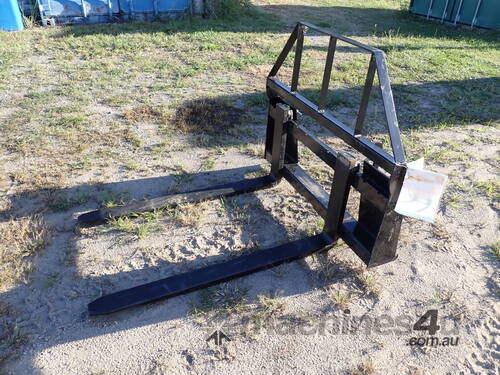 caption Fork attachment for skid steers
