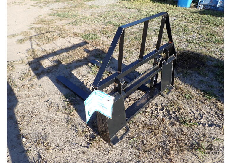 caption Fork attachment for skid steers