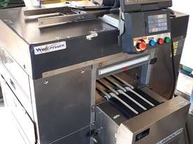 AW-4600CPR is a fully automatic, integrated weigh/wrap/label system for meat/food in line wrapping - picture0' - Click to enlarge
