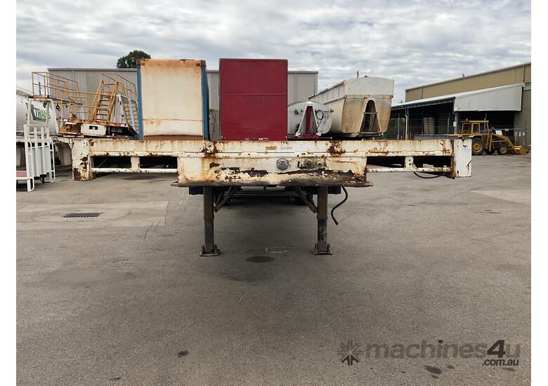 caption Custom Tri-Axle Flat Deck Trailer