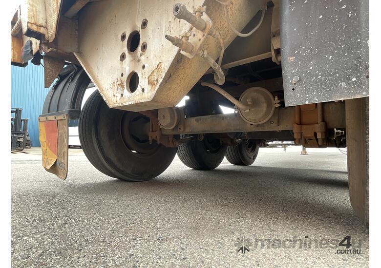 caption Custom Tri-Axle Flat Deck Trailer