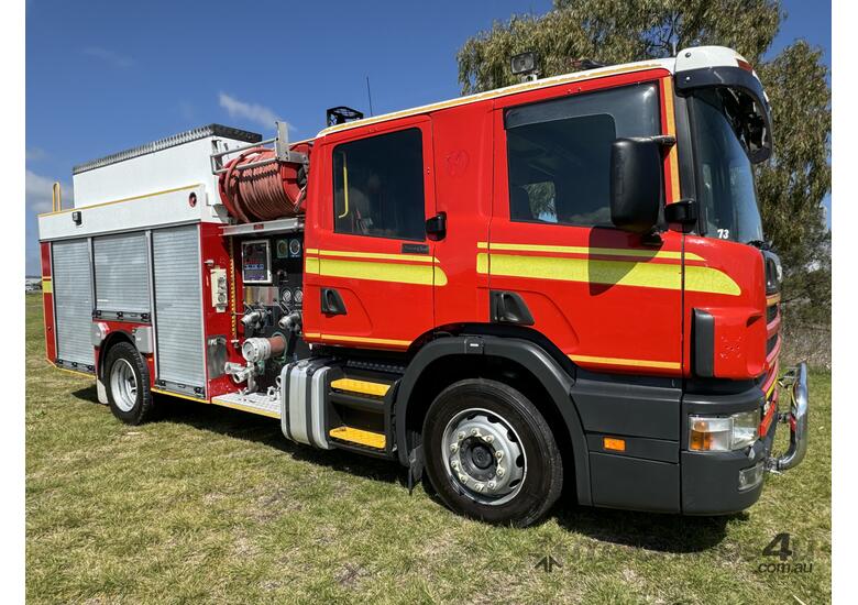 caption Scania P94D 300 4x2 Automatic Crewcab Firetruck. Ex QLD Fire & Rescue Service.