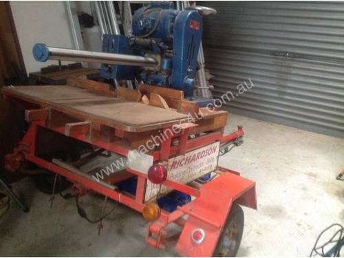Vintage Sawmaster, with long radial arm, wth rollers, stands and trailering 