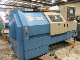 Hyundai HIT 30S CNC Lathe and Bartec Rapid Feed 895 Barfeeder - picture0' - Click to enlarge