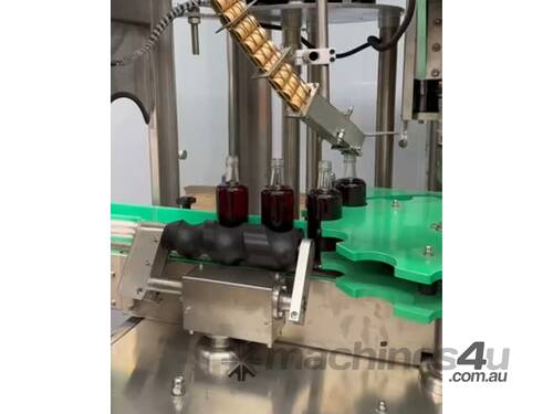 caption Used Automatic Inline ROPP Capper - Distillery Equipment