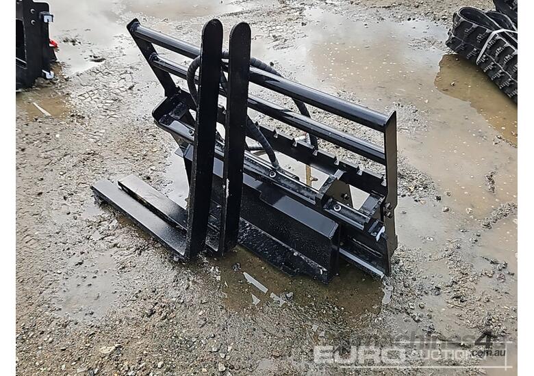 caption Unused Captok Side Shift Forks to suit Mini Skidsteer Loader