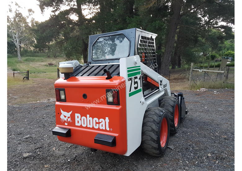 caption Skid steer loader