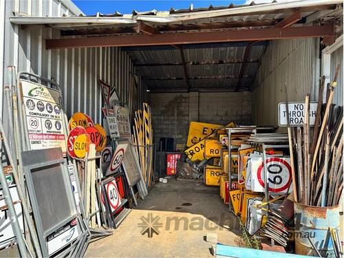 caption HUGE QTY OF ROAD SIGNS ETC